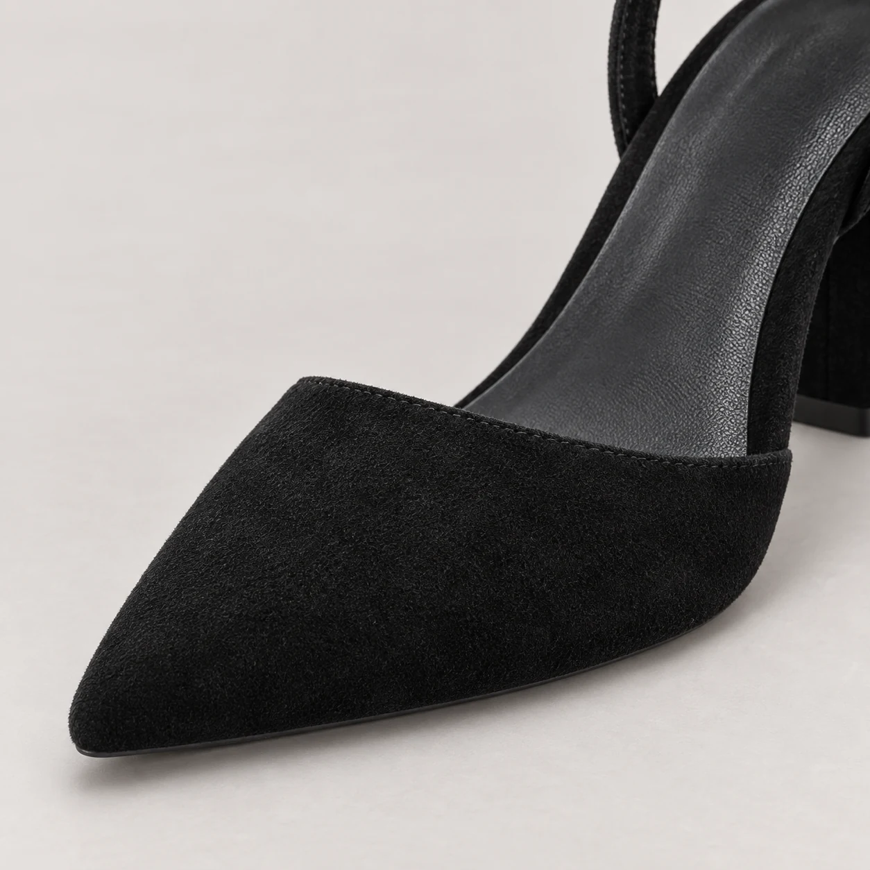 Close-up of the pointed toe and fine black suede texture on the Midnight Allure heel
