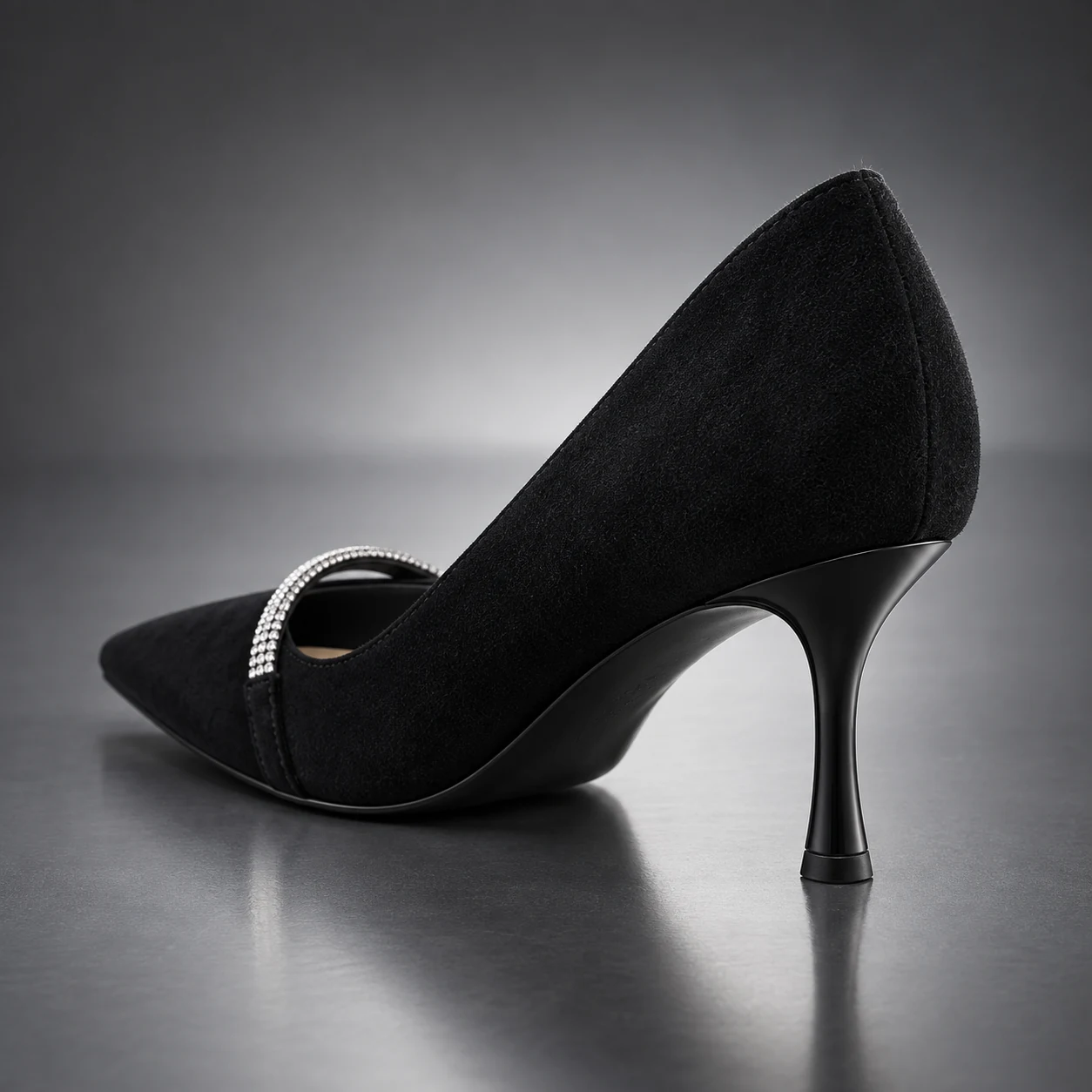 Petite woman wearing black suede rhinestone heels with an ivory blazer and black silk skirt at an art gallery