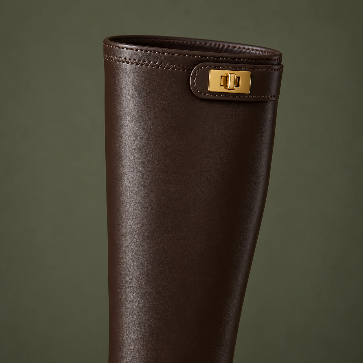 Close-up of the Brown Knee-High Boot shaft and gold turn-lock detail