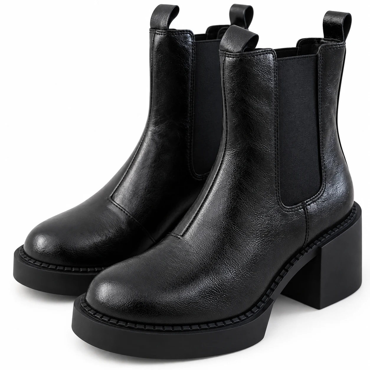 Close-up of Black Short Chelsea boot toes, leather texture, welt and platform