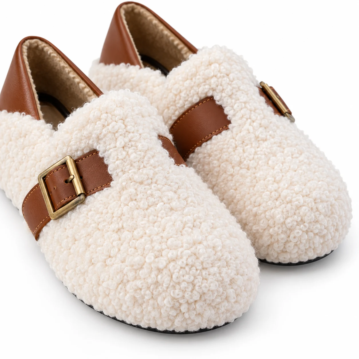Close-up of ivory Shearling Mary Jane rounded toes and curly plush texture